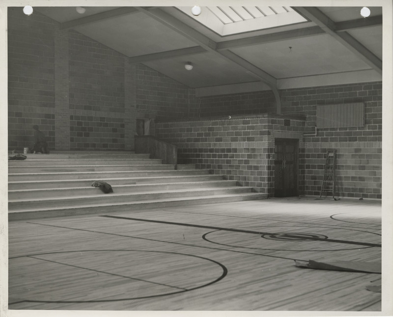 Photograph of school building gymnasium bleacher construction in Colfax