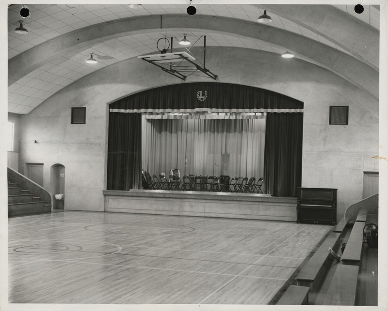 Photograph of the stage in a school gymnasium in Luverne
