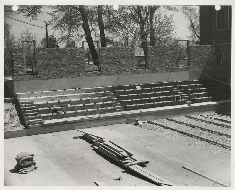 Photograph of school gymnasium bleacher construction in Neola