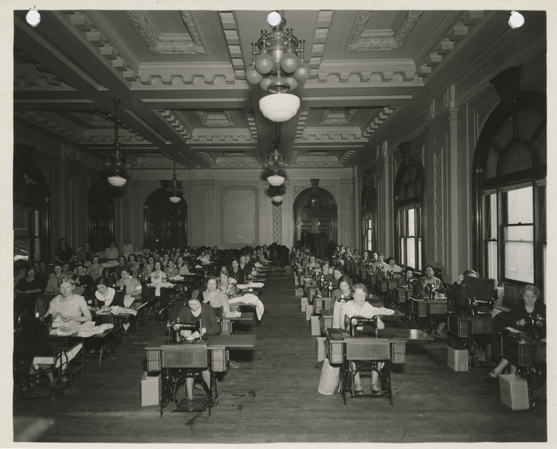 Photograph of people in a sewing room