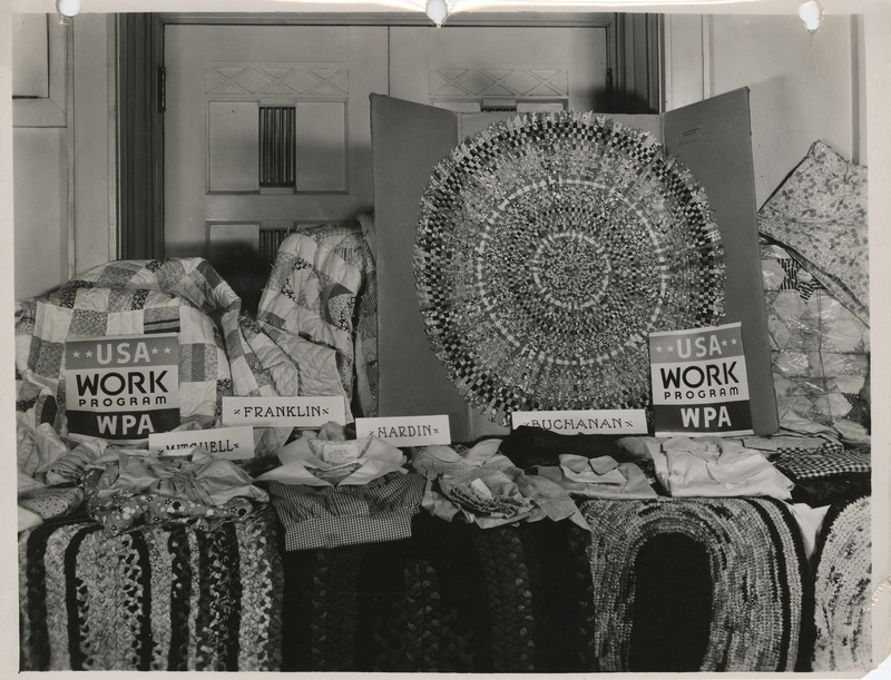 Photograph of items displayed for the district sewing room exhibit in Waterloo