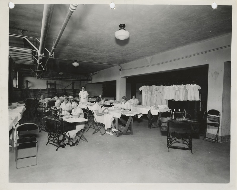 Photograph of people in a county sewing room in Waverly