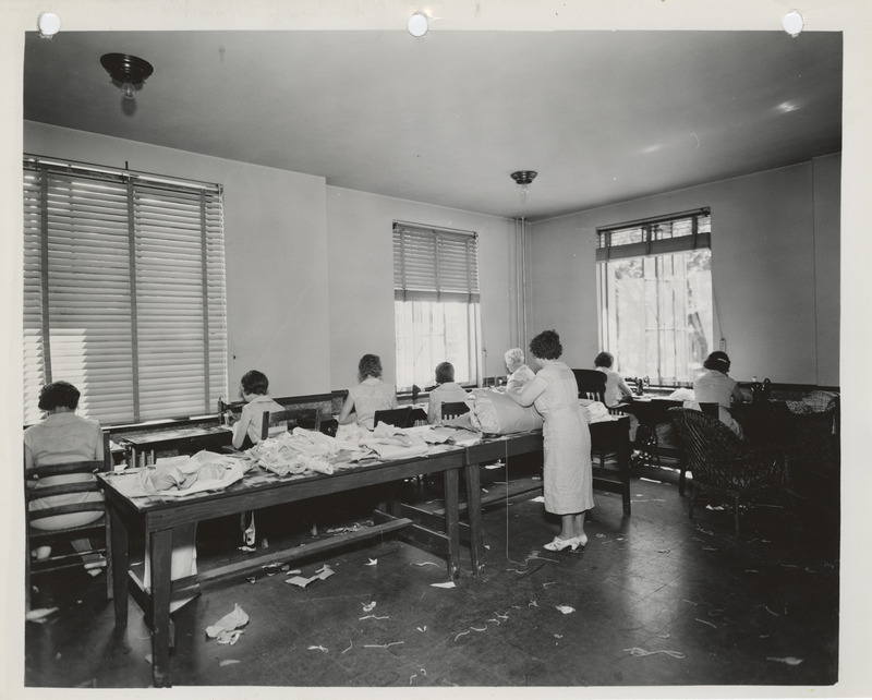 Photograph of people in a county sewing room in New Hampton