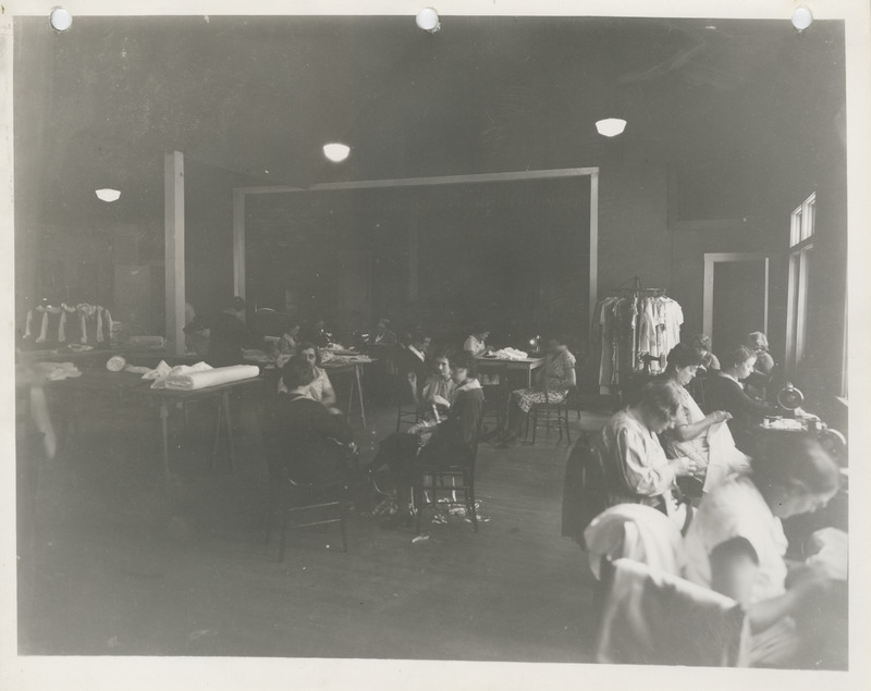 Photograph of people in a sewing room in Burlington