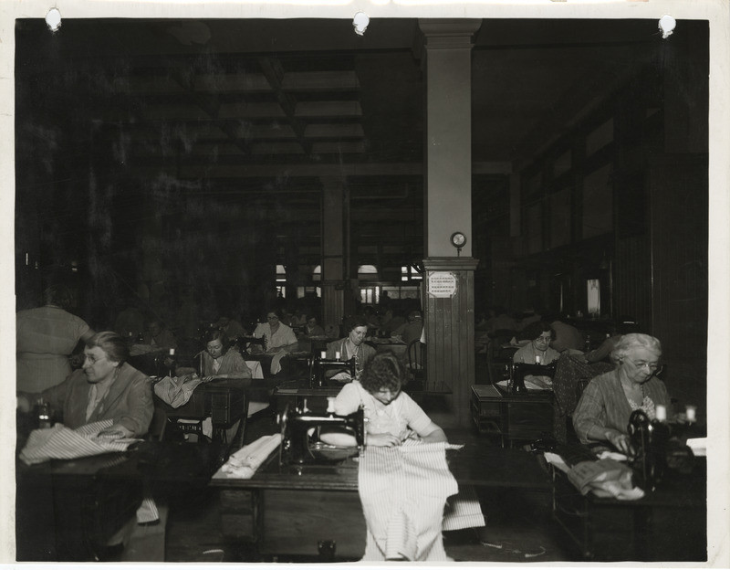 Photograph of people in a county sewing room in Dubuque