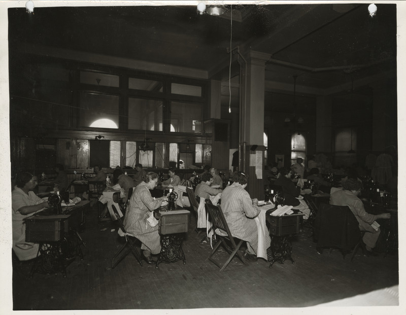Photograph of people in a county sewing room in Dubuque