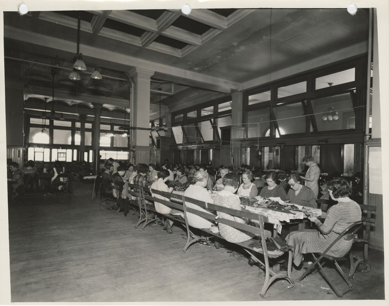 Photograph of people in a sewing room in Dubuque