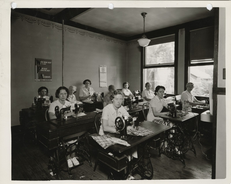 Photograph of people in a sewing room in Charles City
