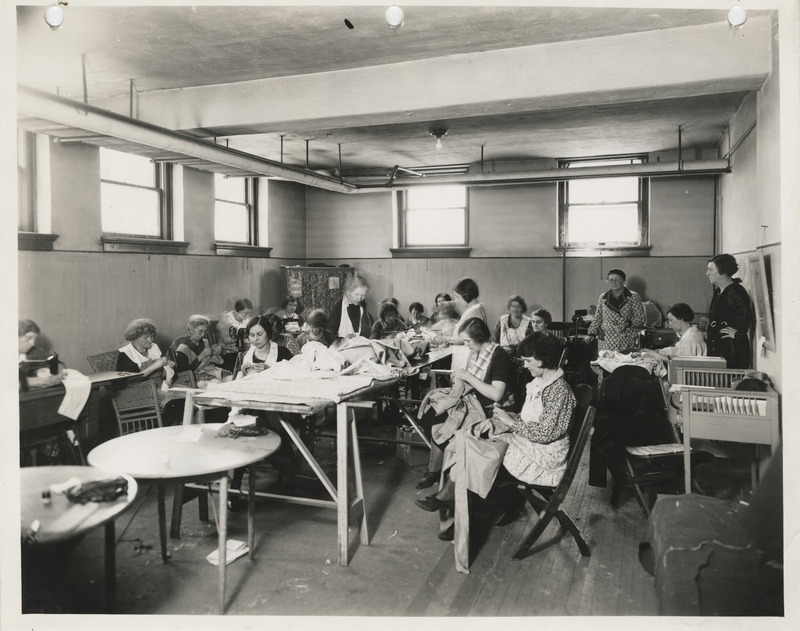 Photograph of people in a sewing room in Keokuk