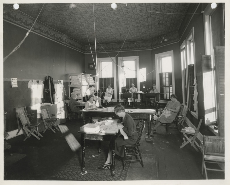 Photograph of people in a sewing room in Glenwood