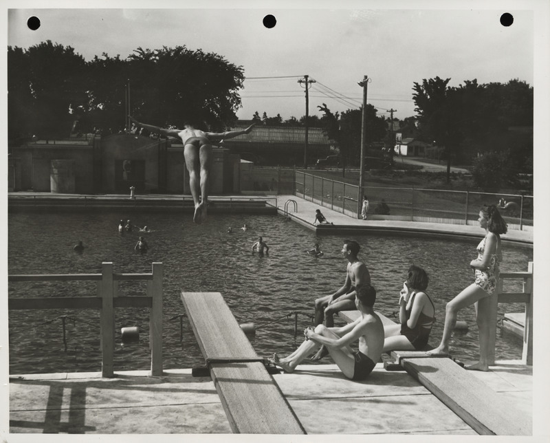 Photograph of people using the municipal swimming pool in Spencer