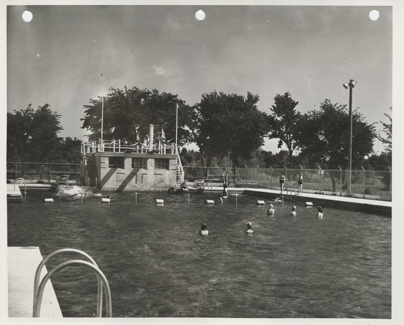 Photograph of people using the municipal swimming pool in Spencer