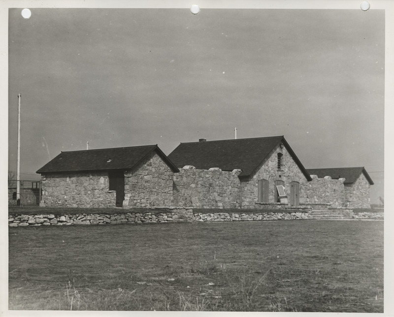 Photograph of the exterior view of the swimming pool and bathhouse in Pocahontas