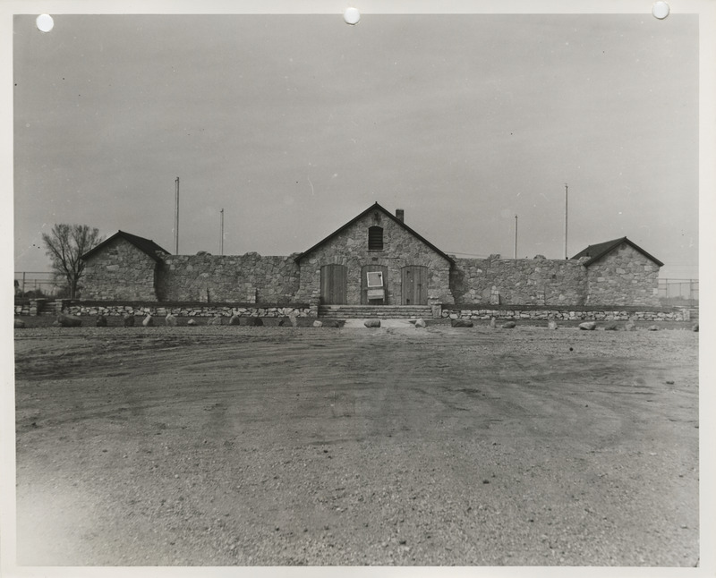 Photograph of the exterior view of the swimming pool and bathhouse in Pocahontas