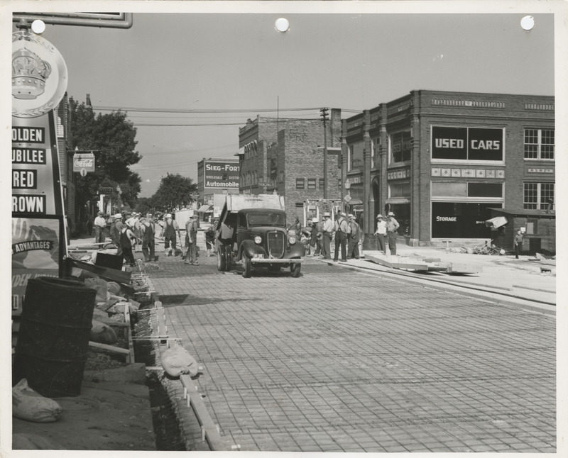 Photograph of people paving the street in Fort Dodge