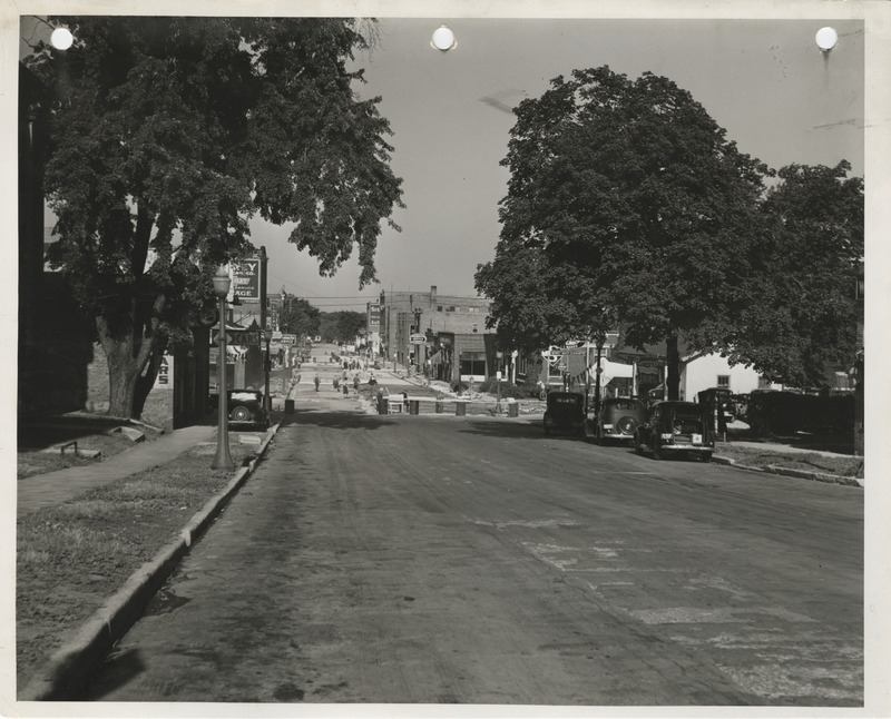 Photograph of people paving the street in Fort Dodge