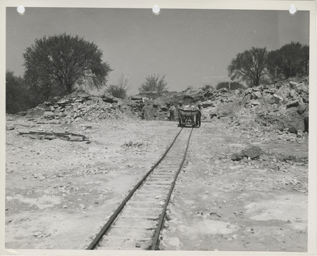 Photograph of people pushing a trolly at a quarry near Columbus Junction