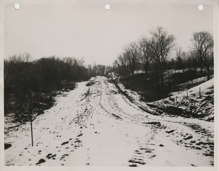 Photograph of a farm to market road where grading is being done in Muscatine County
