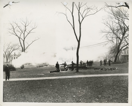 Photograph of people grading and installing lights for a softball diamond at Lafayette Square in Davenport