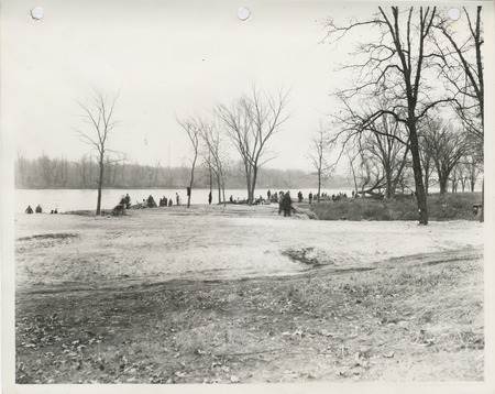 Photograph of people landscaping the bank of the Mississippi River in Davenport