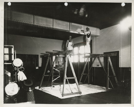 Photograph of people painting the interior of a fire station in Davenport