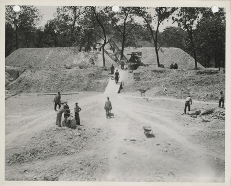 Photograph of people working to stockpile gravel for winter to spread on farm to market roads in Appanoose County