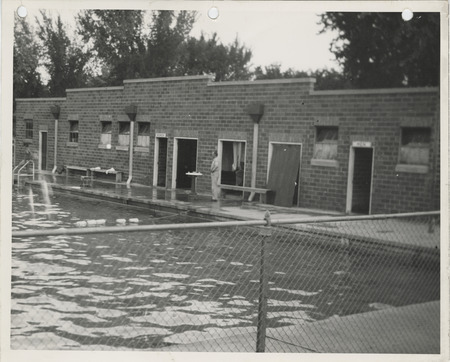 Photograph of person standing by the edge of the municipal swimming pool in Jefferson