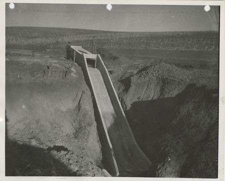 Photograph of people standing by a culvert in Guthrie County