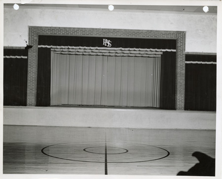 Photograph of the stage at the high school gym in Panora