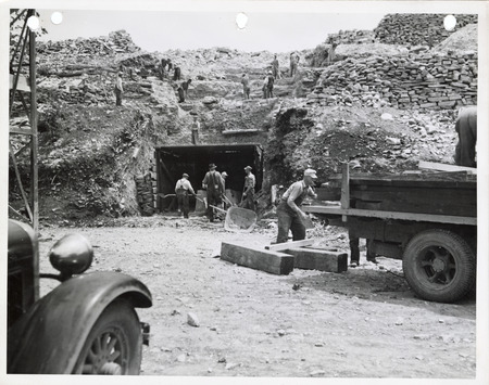 Photograph of people working by a quarry tunnel in Madison County