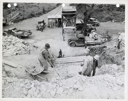 Photograph of an elevated view of people working at a quarry in Madison County