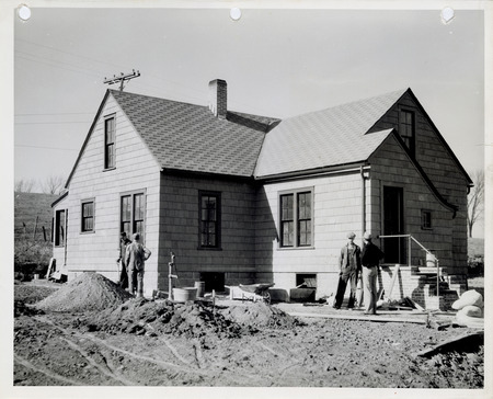 Photograph of people remodeling a caretaker's home at the sewage disposal plant in Oskaloosa