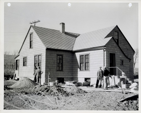 Photograph of people remodeling a caretaker's home at the sewage disposal plant in Oskaloosa