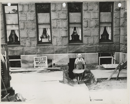 Photograph of person repairing the county courthouse in Knoxville