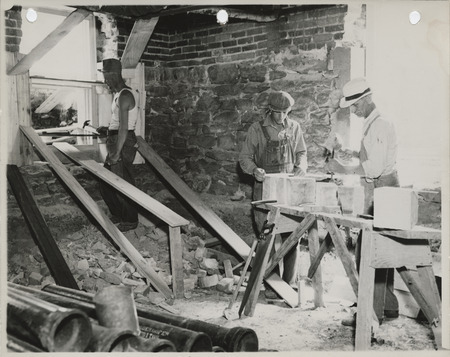 Photograph of people repairing the county courthouse in Knoxville