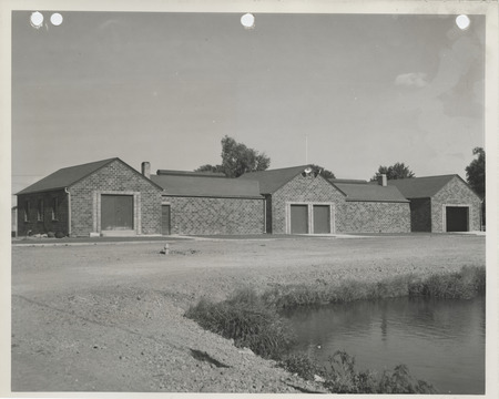 Photograph of a bathhouse and shelter house at a city park in Pella