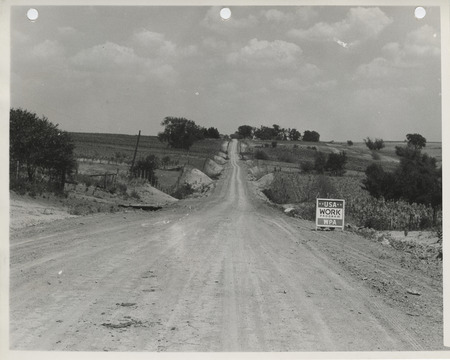 Photograph of a cleared and graded farm to market road in Monroe County