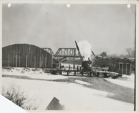 Photograph of the construction of a river bridge in Des Moines