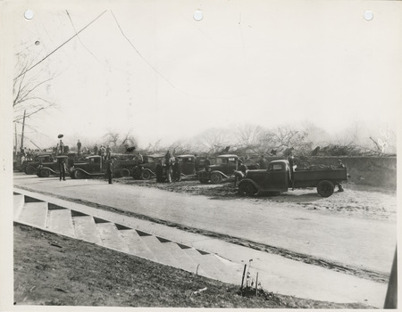Photograph of people filling over a culvert at E 33rd and Easton in Des Moines