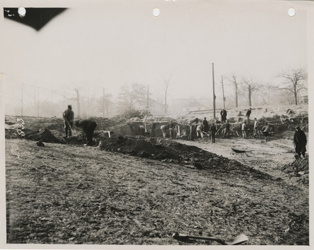 Photograph of people constructing a swimming pool at Good Park in Des Moines