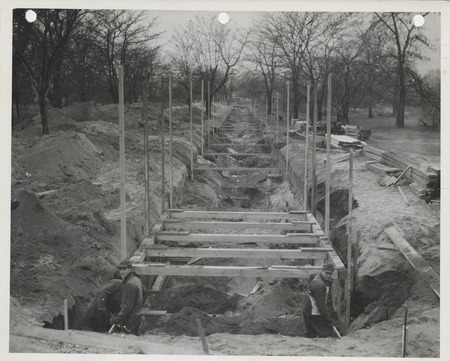 Photograph of people constructing an outfall sewer at SE 14th St. in Des Moines