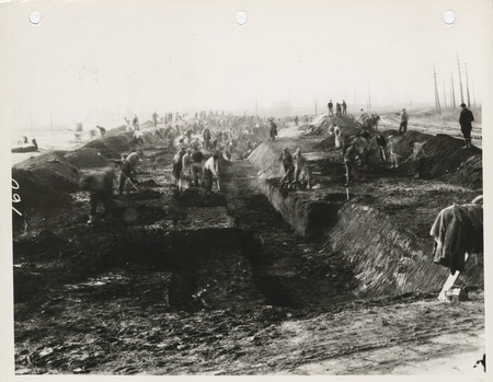 Photograph of people constructing a sanitary and storm sewer at E 18th and Dean Ave. in Des Moines