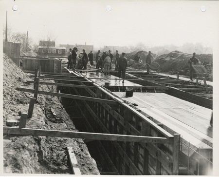 Photograph of people constructing a storm sewer at SE 5th and Hartford in Des Moines