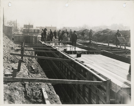 Photograph of people constructing a storm sewer at SE 5th and Hartford in Des Moines