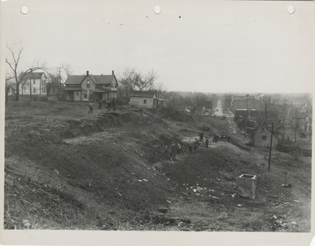 Photograph of people grading a hill at W 2nd and Bluff in Des Moines