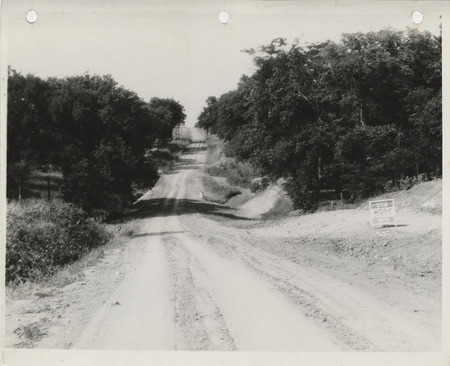 Photograph of clearing and grading a farm to market road in Story County
