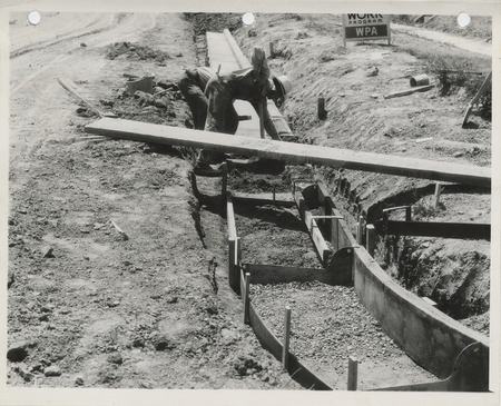Photograph of people constructing street curbs in Nevada