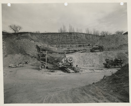 Photograph of equipment crushing rock for the farm-to-market road at the quarry in Thurman