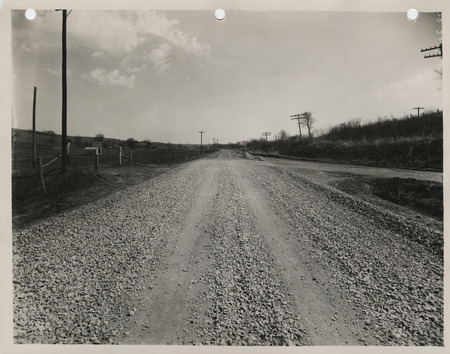 Photograph of farm-to-market road surfacing with crushed rock in Council Bluffs