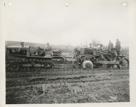 Photograph of people grading a farm to market road in Pottawattamie County